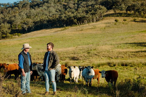 Two generations of the Hunter Natural farm family with their cattle